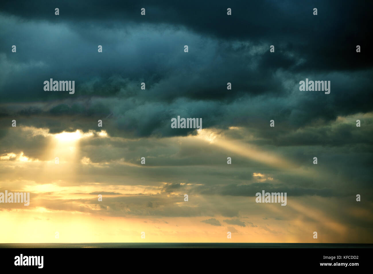 MAURITIUS, a hint of the Indian Ocean under a dramatic evening sky, the West Coast Stock Photo