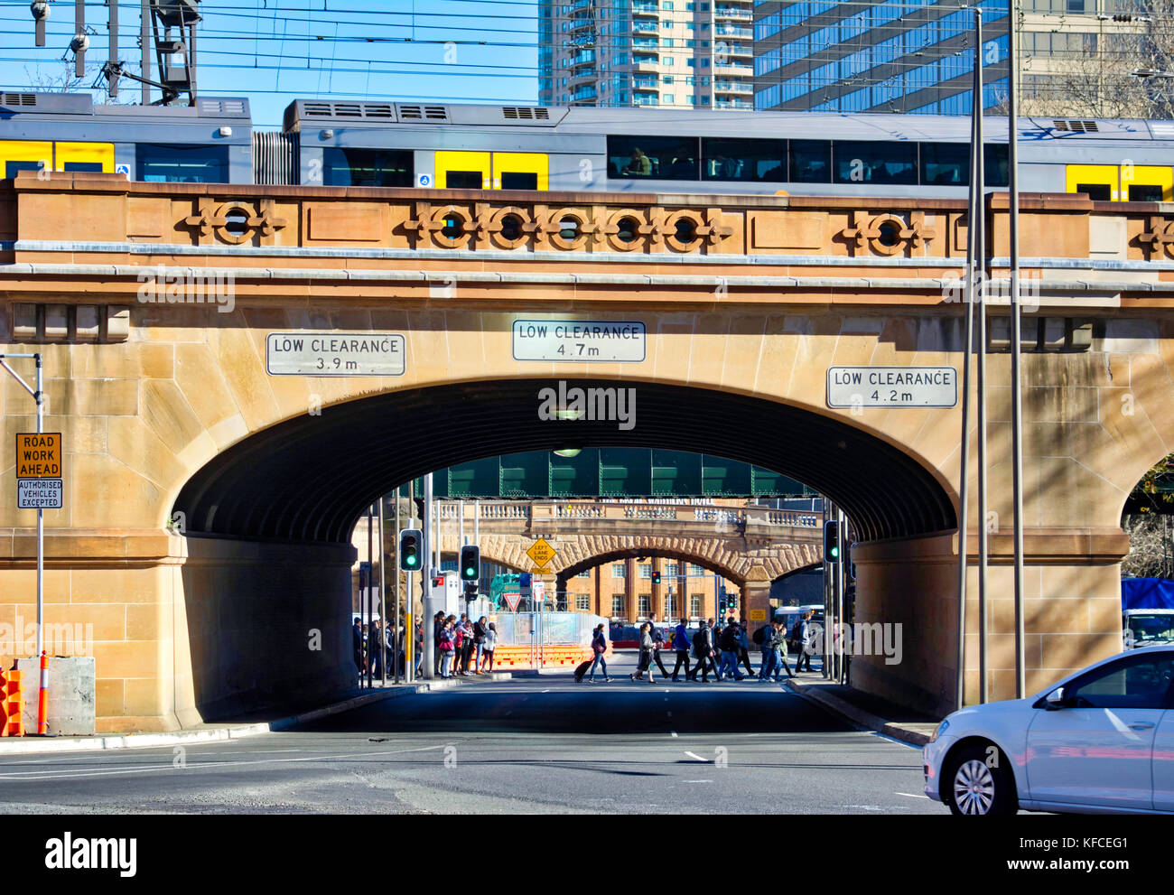 A train passing on top of an arched road near central train station in Sydney, Australia. Stock Photo