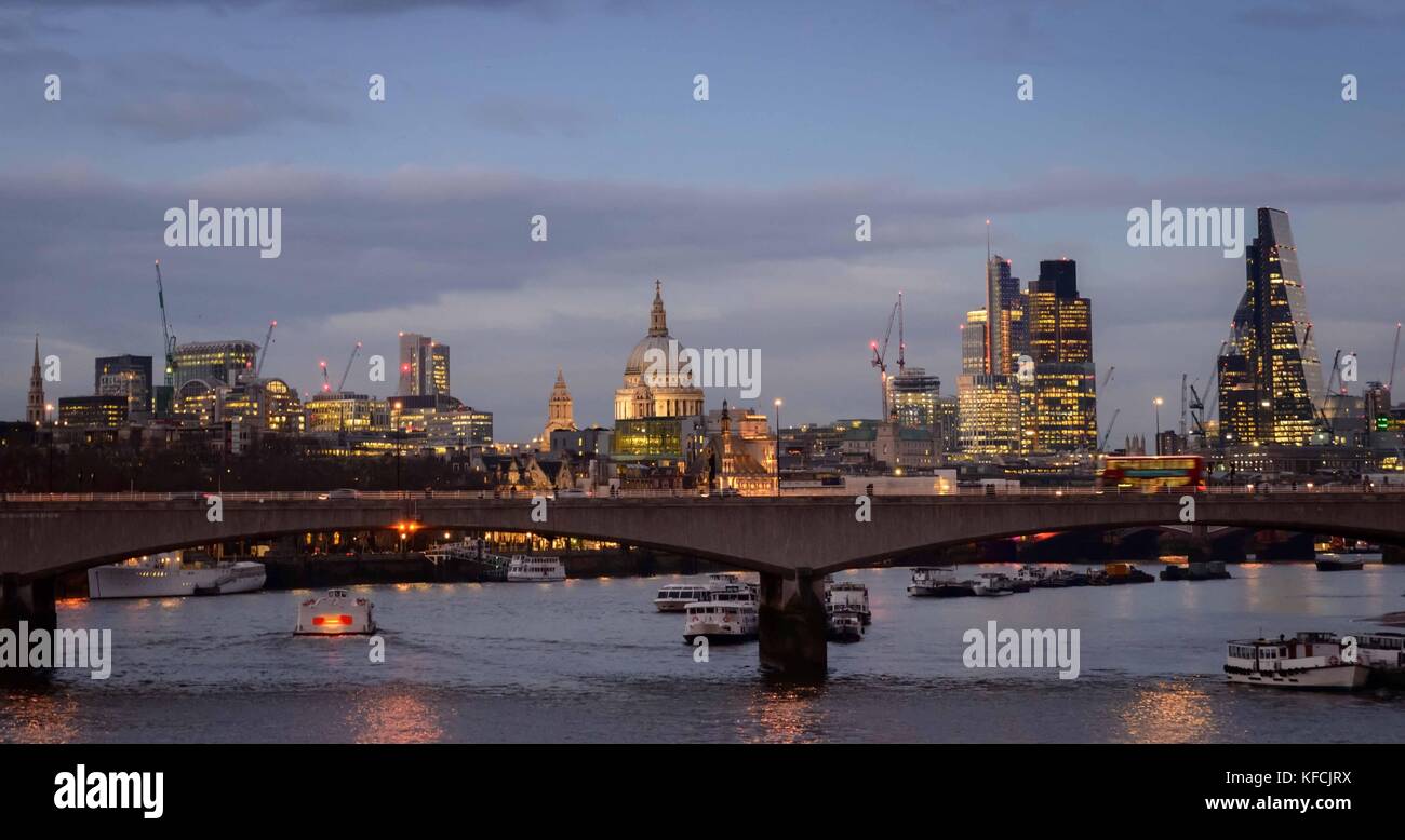 City of London skyline at sunset on River Thames Stock Photo