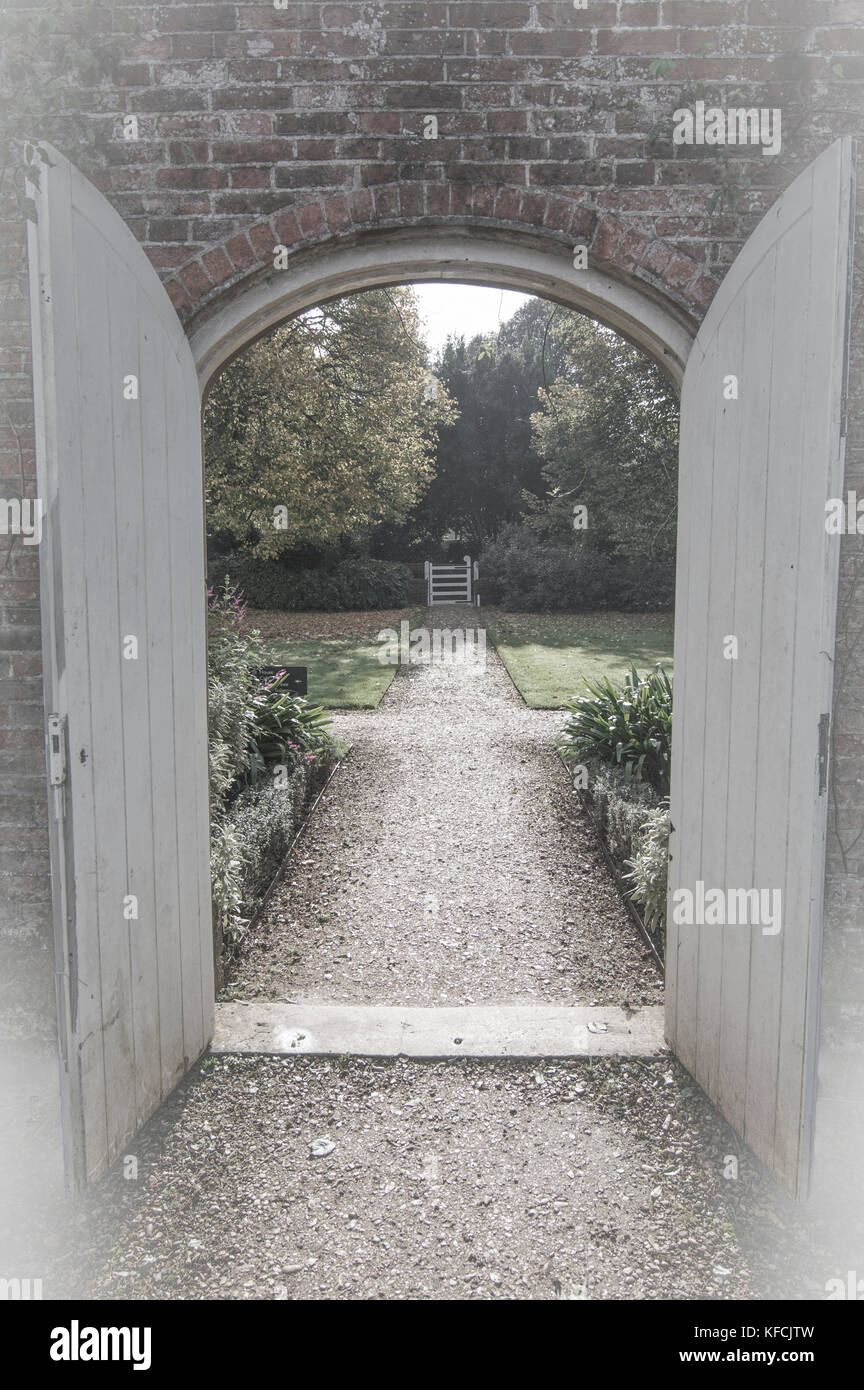 View through the door in muted colours, garden - photo Stock Photo