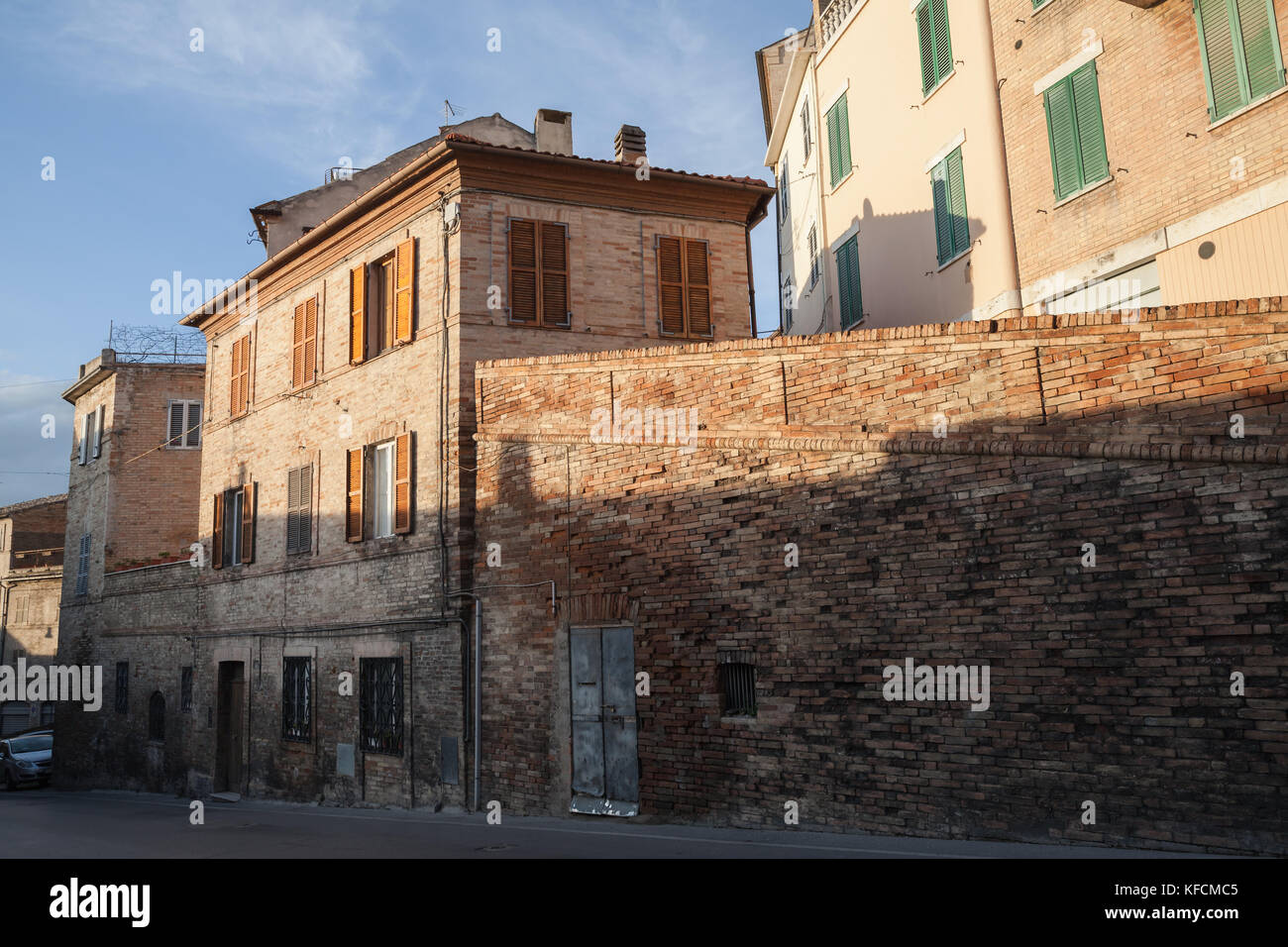 Street view of old Italian town in evening sun light, Fermo, Italy Stock Photo