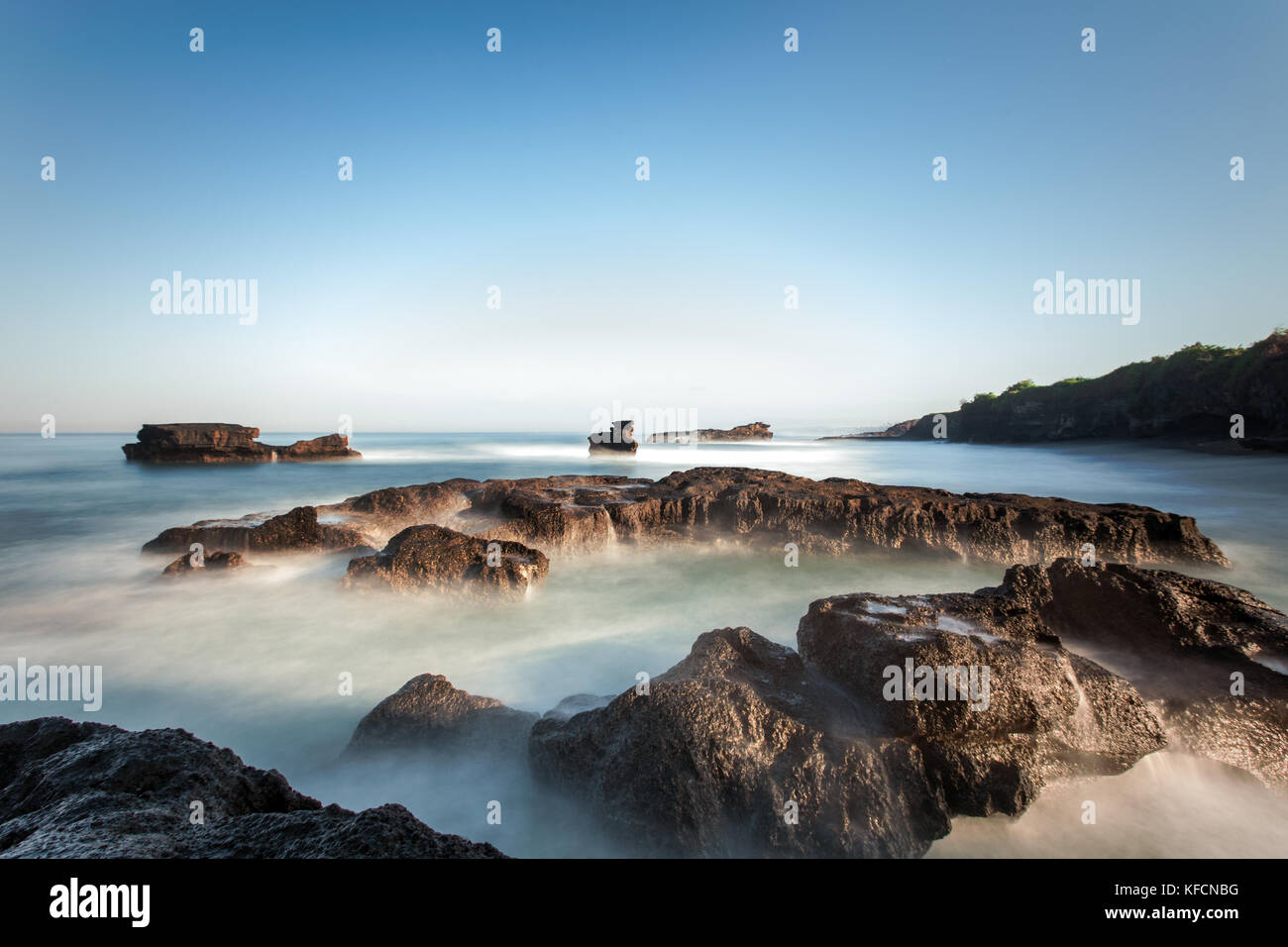 Dramatic misty seascape during a fresh summers morning with sea stacks ...