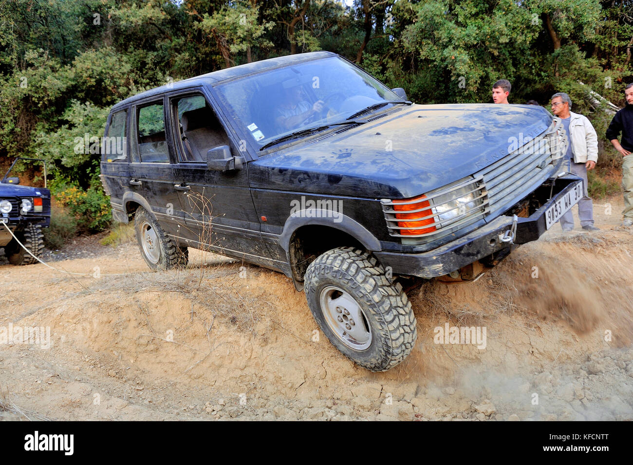 Range Rover in bad shape ready to tip in a hole of a trial circuit ...