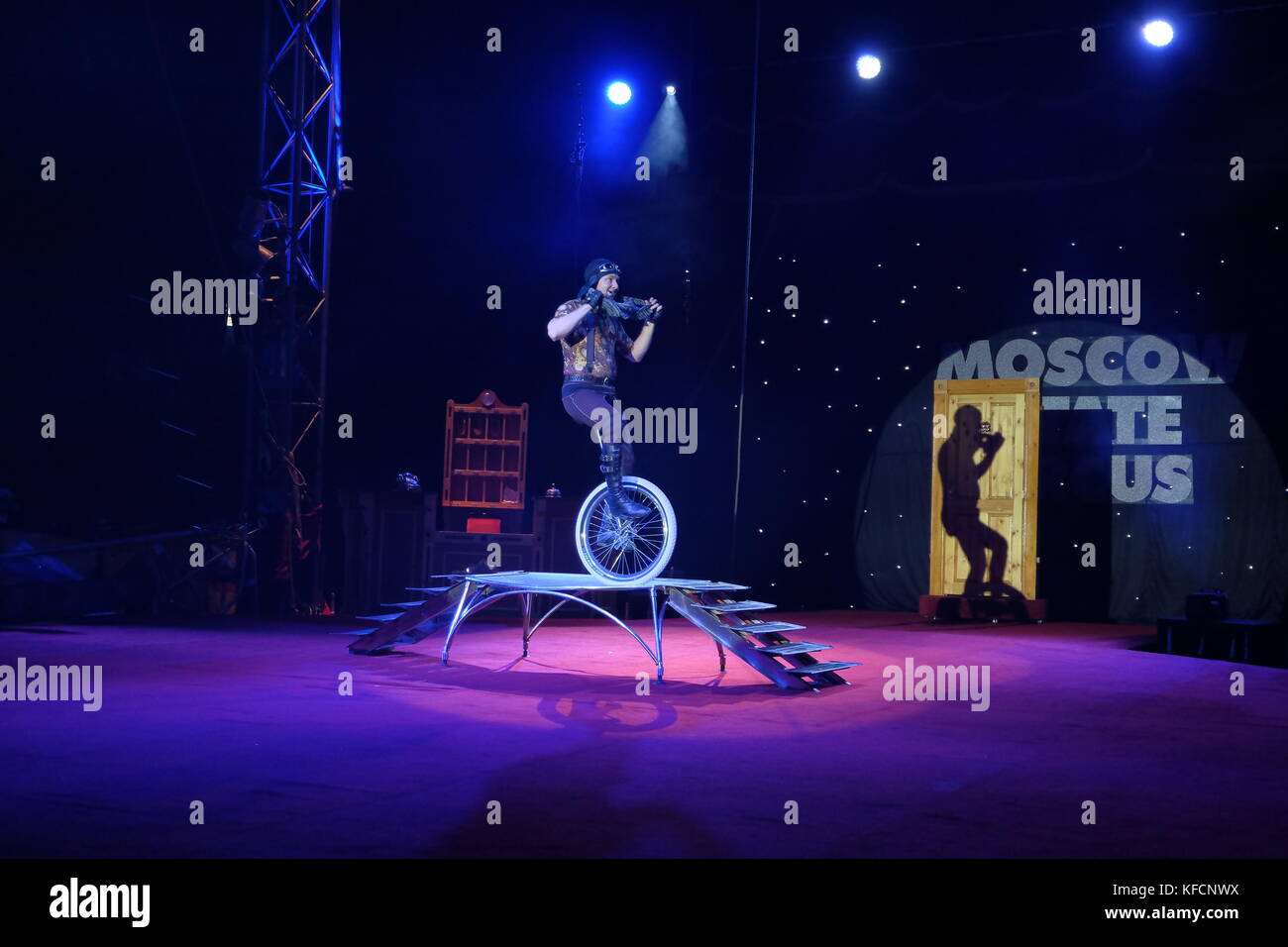 circus performers unicycle Stock Photo Alamy
