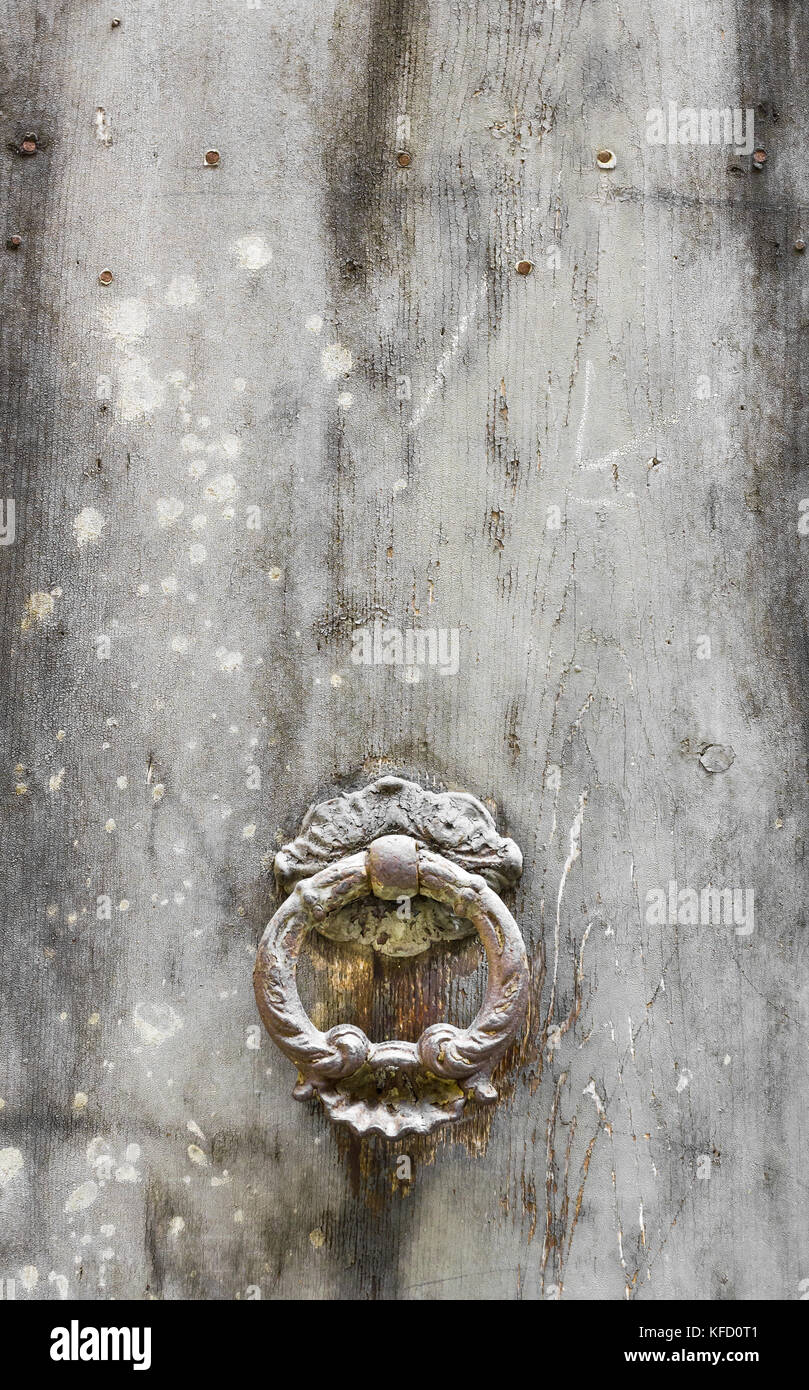 Ancient door knocker on white vintage background. Stock Photo