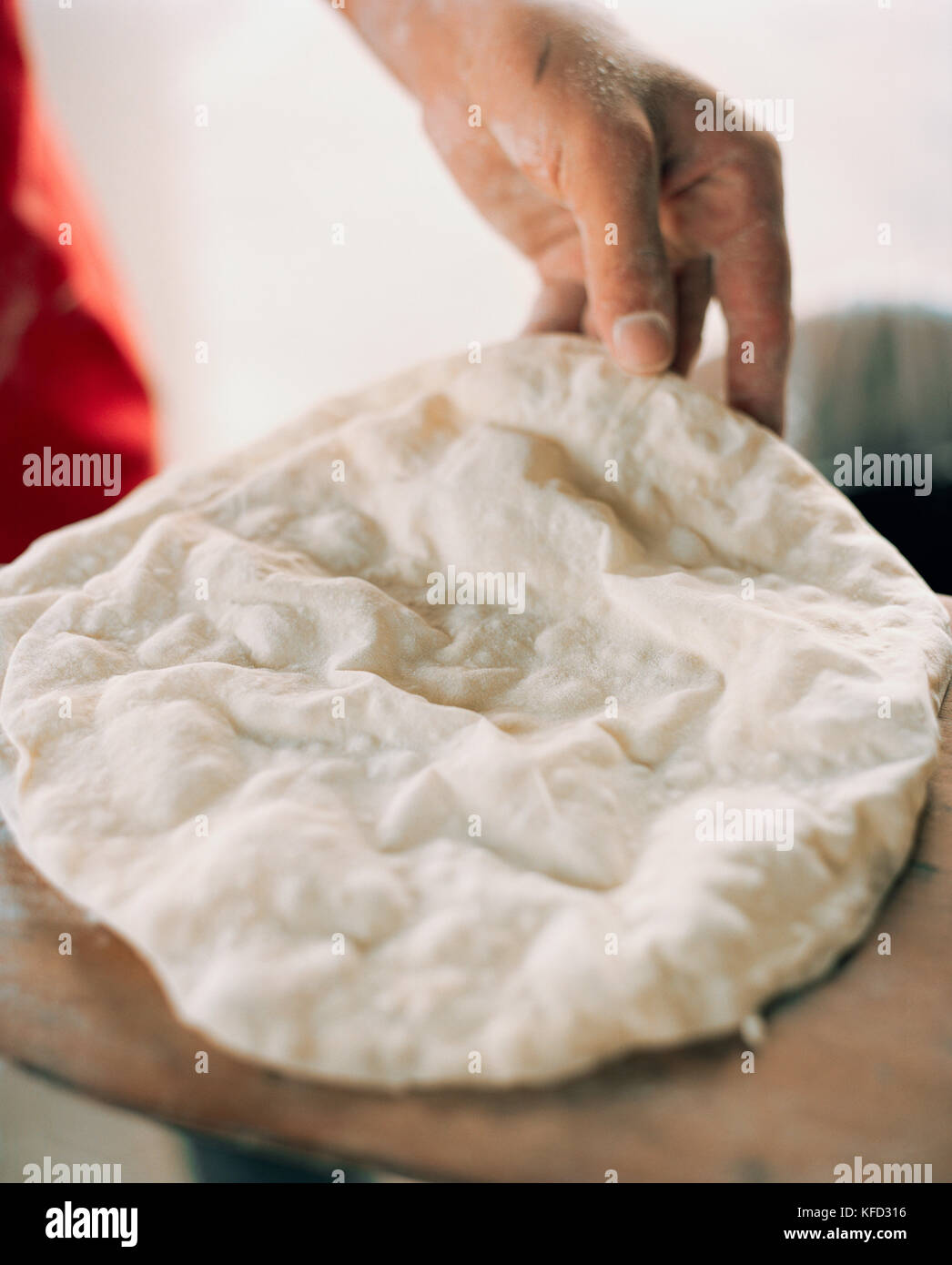 OMAN,  Muscat, person making flat bread, close-up Stock Photo