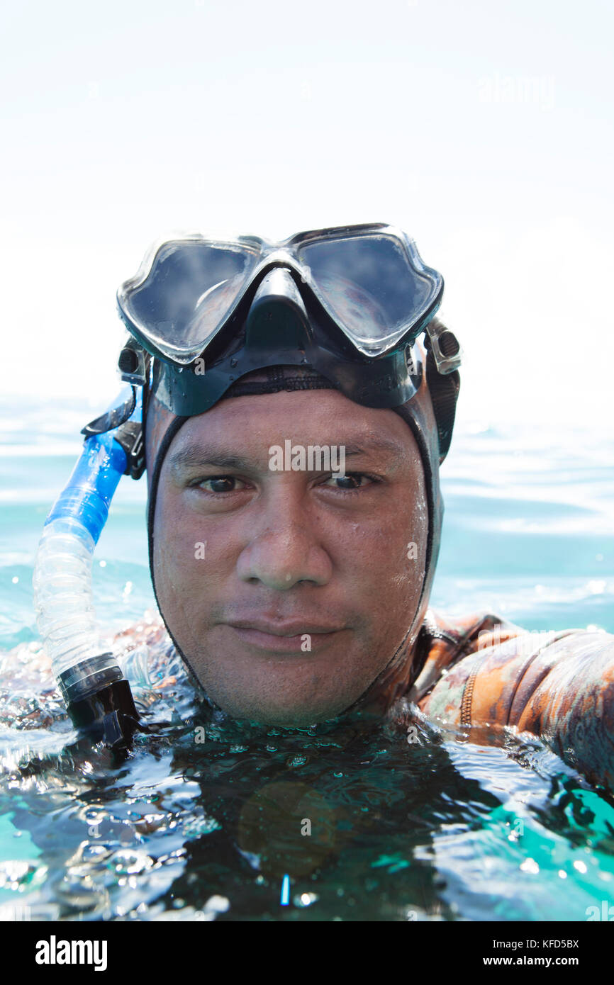 FRENCH POLYNESIA Moorea Island Spearfisherman At Opunohu Bay Stock french-polynesia-moorea-island-spearfisherman-at-opunohu-bay-stock