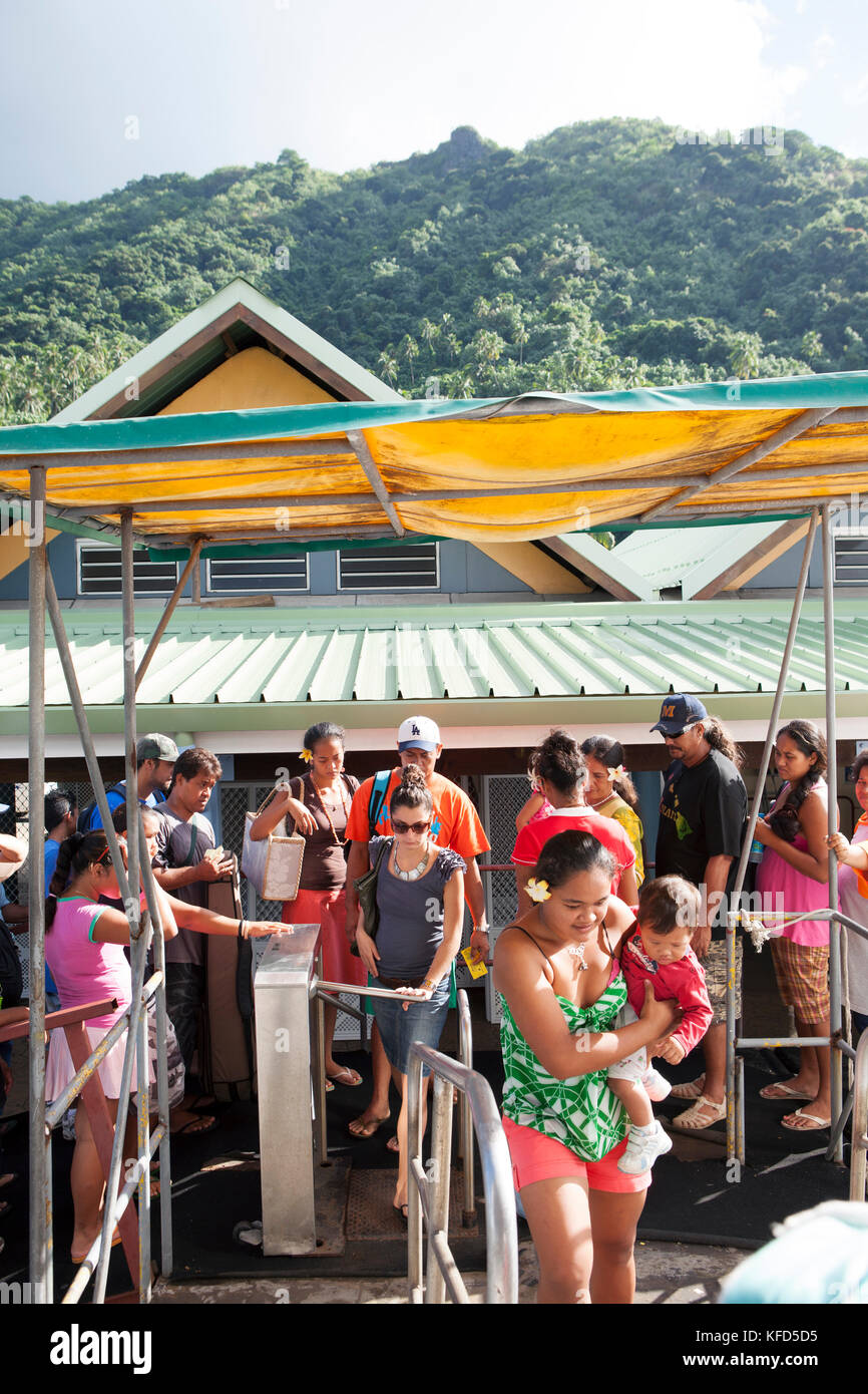 FRENCH POLYNESIA, Moorea. Passengers boarding a ferry to Papeete