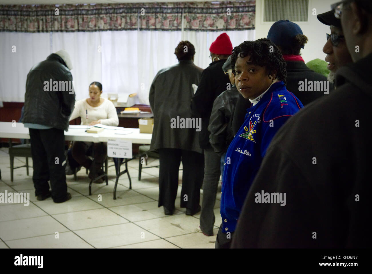 Voters wait in line to cast the ballot at a poling station in Philadelphia, PA, on Election Day. Stock Photo