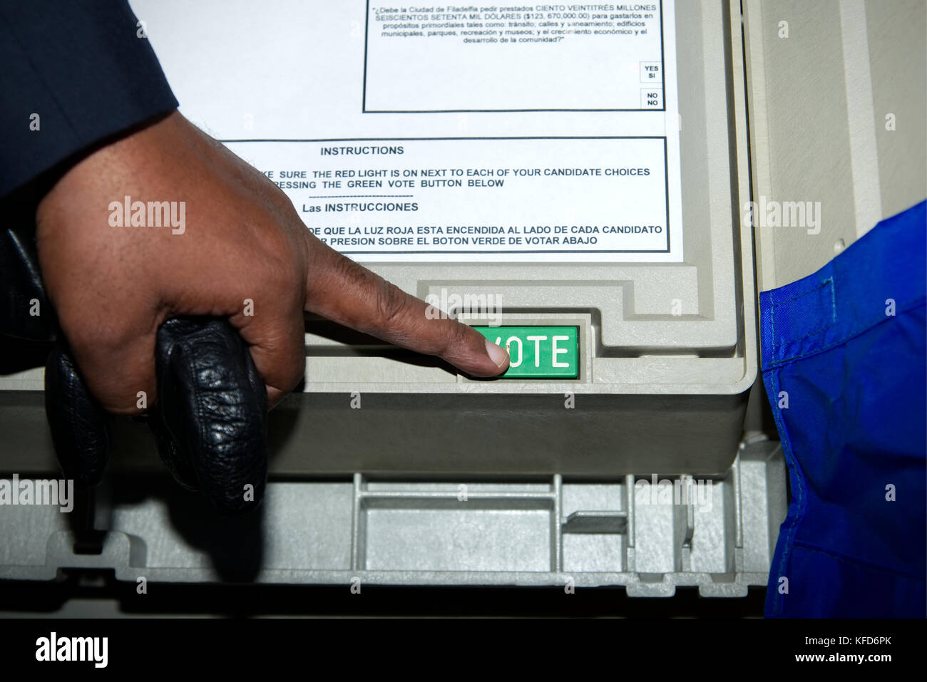 Voter casts the ballot on an electronic voting machine at a polling station on Election Day, in Philadelphia, PA. Stock Photo