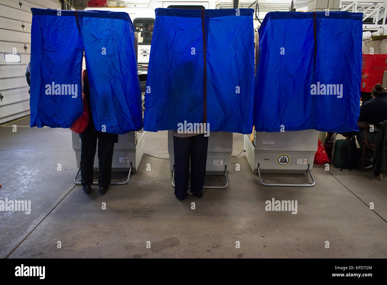 On Election Day, American citizens use electronic voting machines to cast the ballot at a