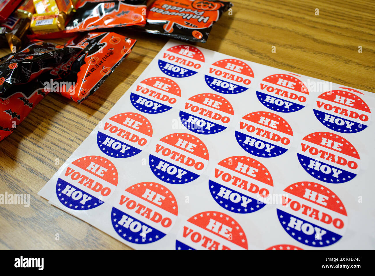 On Election Day a sheet with 'I voted Today' stickers in Spanish and candy lay on a table at a polling station, ready to be picked up by voters, in Ph Stock Photo