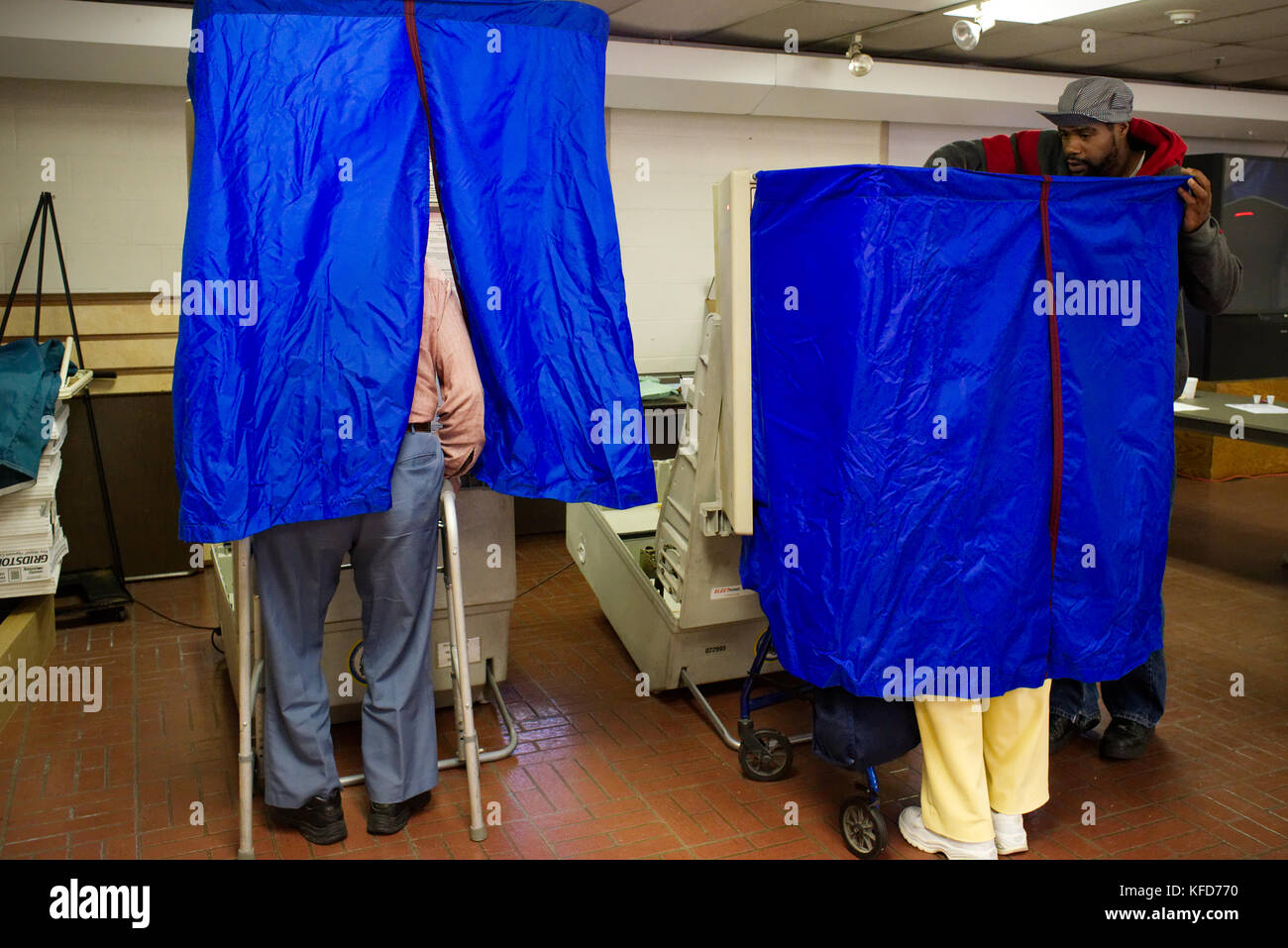 On Election Day, American citizens use electronic voting machines to cast the ballot at a