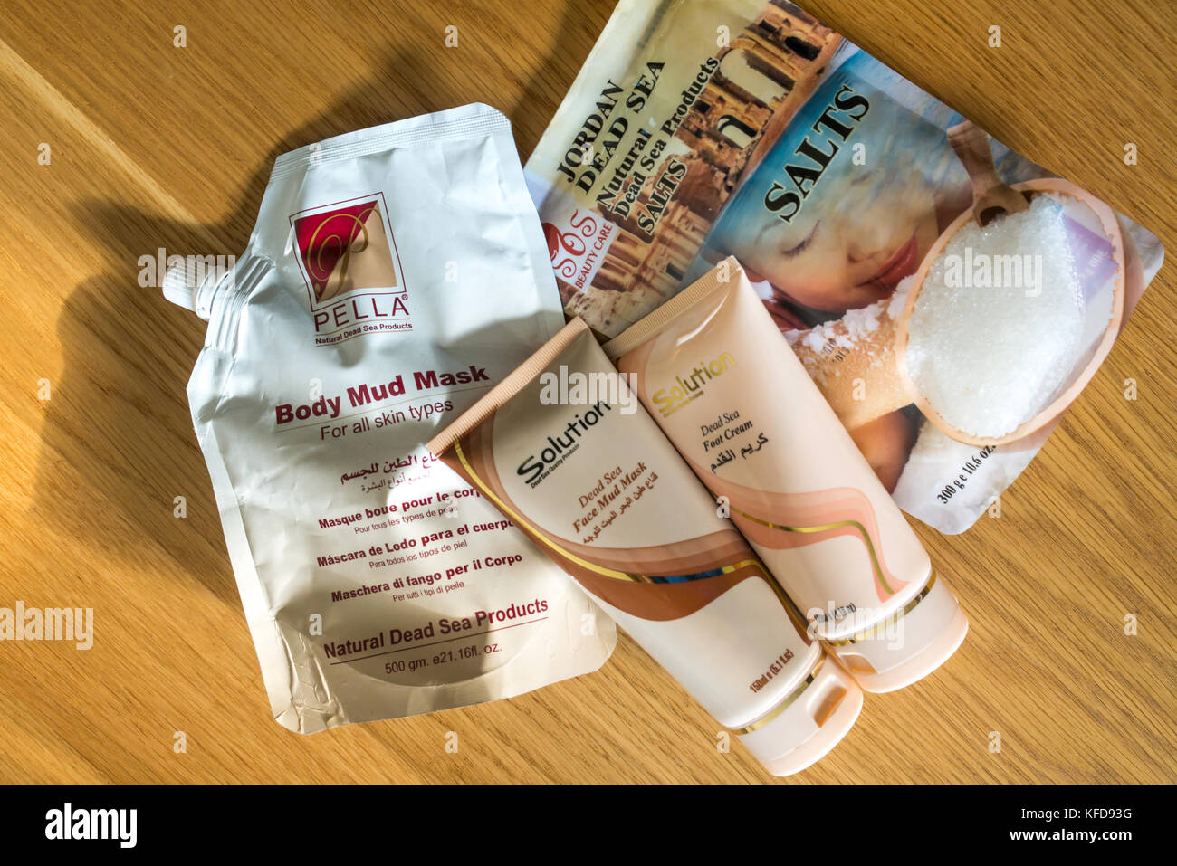 Holiday souvenirs of cosmetic products from the Dead Sea, Jordan, including bath salts, foot cream, body mud mask, and face mud mask Stock Photo