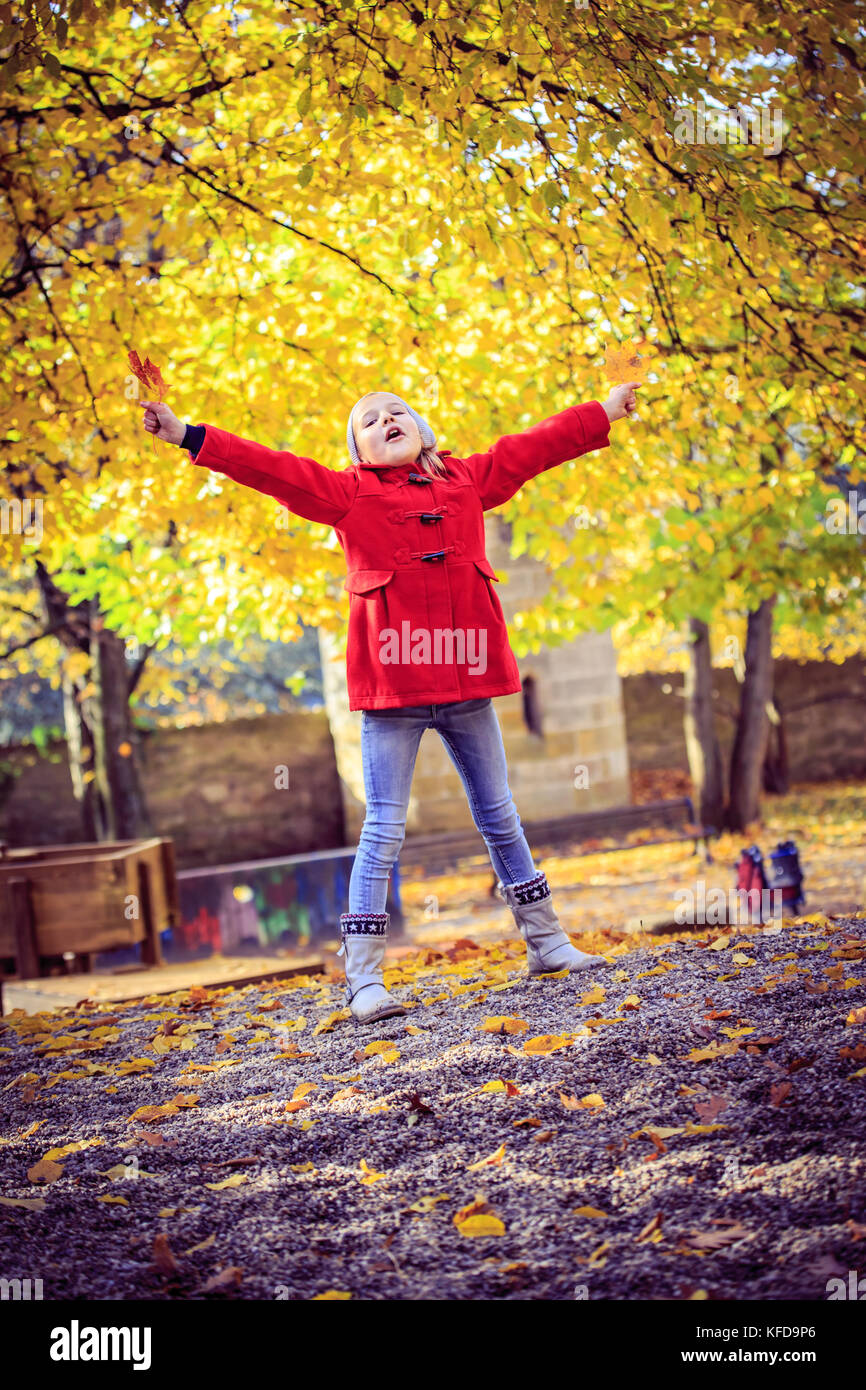 little girl playing on playground in the park Stock Photo - Alamy