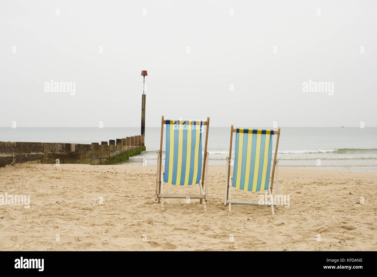 Two deck chairs on the beach at Bournemouth Stock Photo Alamy