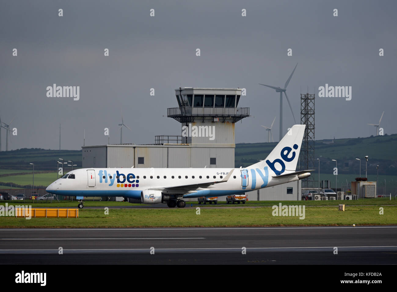 Flybe Embraer ERJ170 200 G-FBJD taxiing past the air traffic control tower at Cornwall Airport Newquay Stock Photo