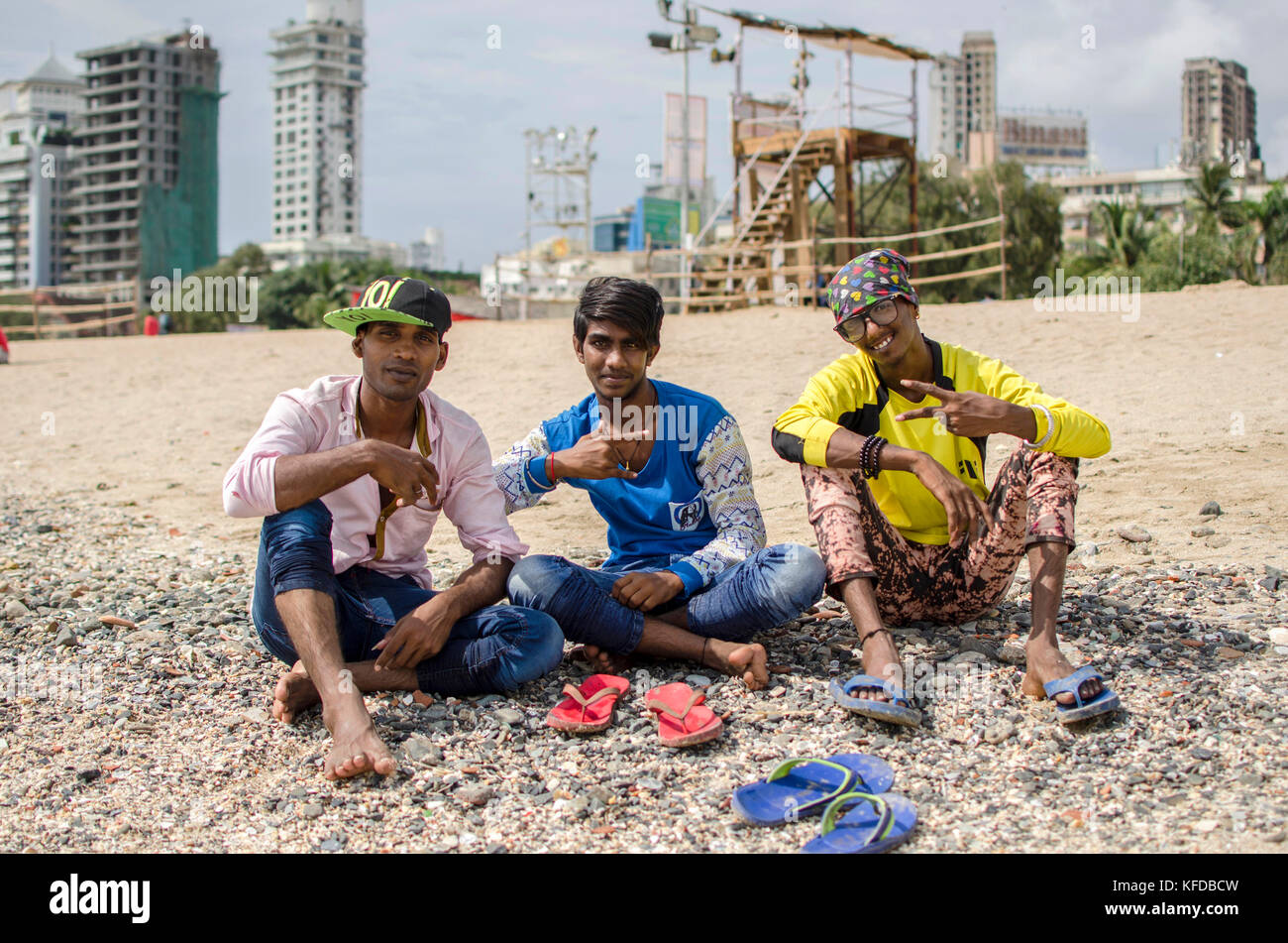 Boys posing on Girguam Chowpatty beach in Mumbai, India Stock Photo