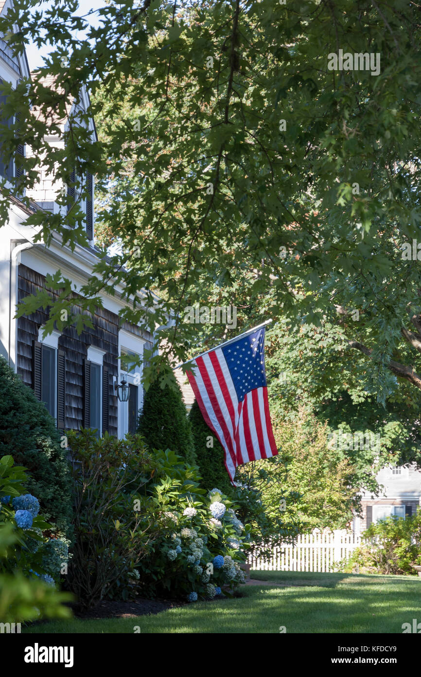 An American flag displayed in front of a Chatham,Massachusetts home. Stock Photo
