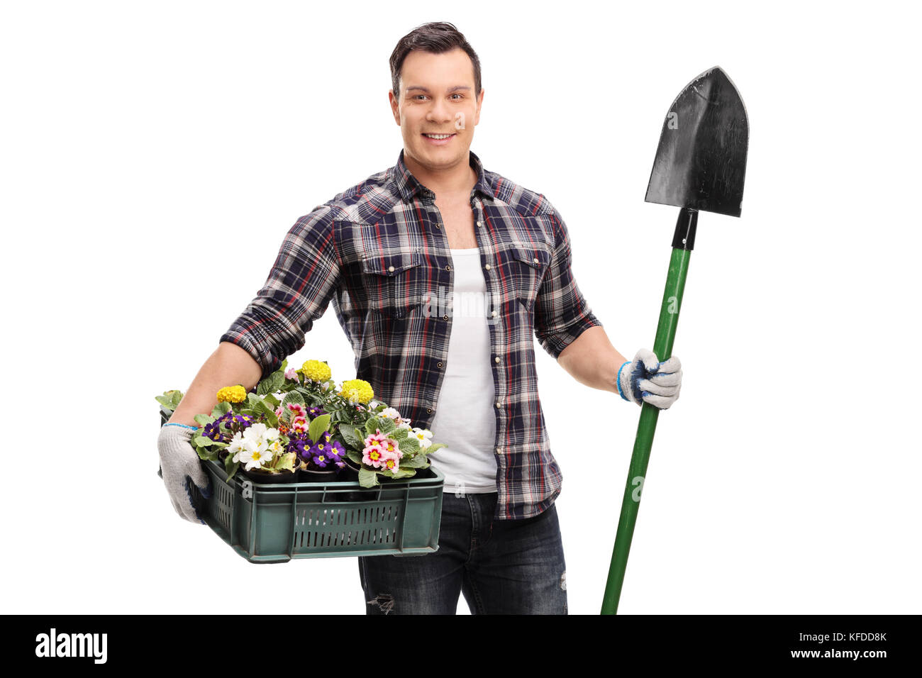Gardener holding a shovel and a crate full of flowers isolated on white background Stock Photo