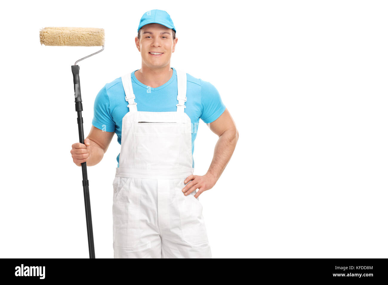 Decorator holding a paint roller and looking at the camera isolated on white background Stock Photo