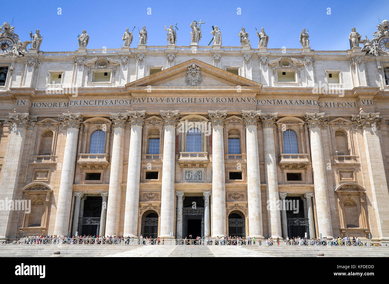 St Peter's Basilica in Rome, Italian Renaissance architecture, and UNESCO world heritage site. Facade with columns, inscription and statues of religio Stock Photo