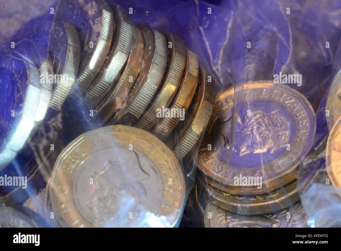 Pound coins in bank bags Stock Photo Alamy