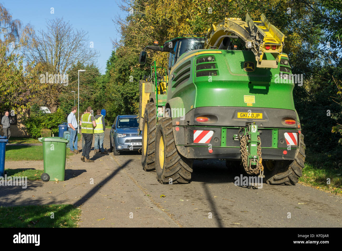 Parked car blocking road for agricultural vehical Stock Photo