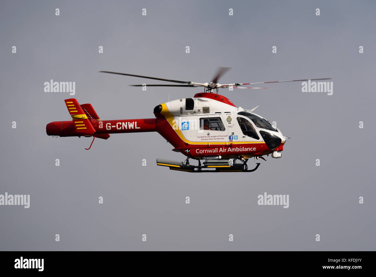 Cornwall Air Ambulance helicopter G-CNWL MD 902 Explorer over Cornwall Airport Stock Photo