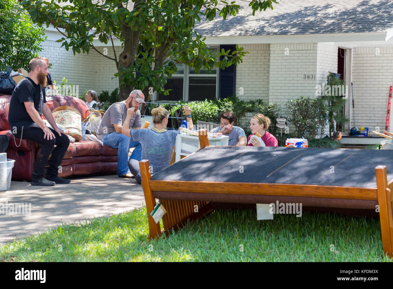 Cleanup begins in Houston after hurricane Harvey and heavy floods. Houston residents rest between cleanup efforts of their homes Stock Photo