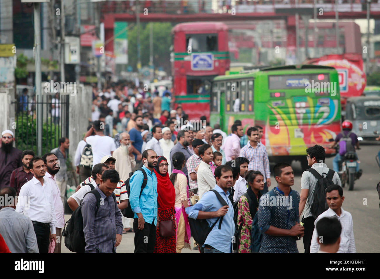 Bangladeshi people wait for bus to travel home ahead of Iftar, in Dhaka, Bangladesh. Stock Photo