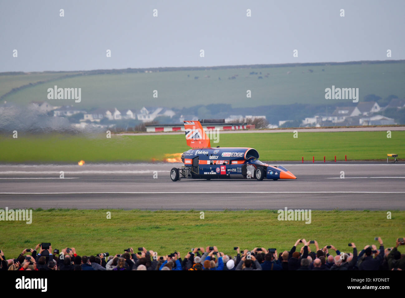 Bloodhound SSC supersonic car at speed with re-heat afterburner engaged from the Eurojet EJ200 jet engine during trials at Cornwall Airport Newquay Stock Photo