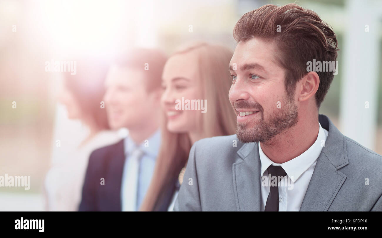 group of business people smiling in an office lined up Stock Photo - Alamy