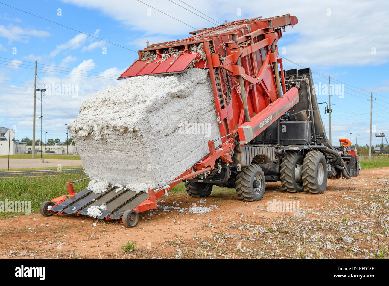 Case IH Module Express 635 tilting back to empty its receiving bay of freshly picked cotton on a cotton farm in rural Alabama. Stock Photo