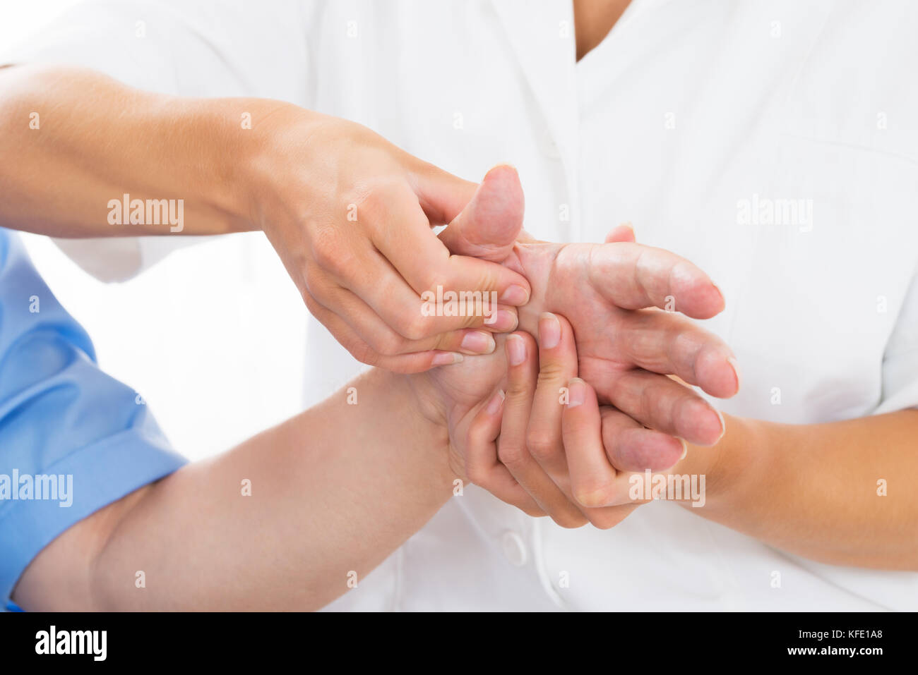 Close-up Of A Person Receiving Palm Massage By Physiotherapist Stock Photo