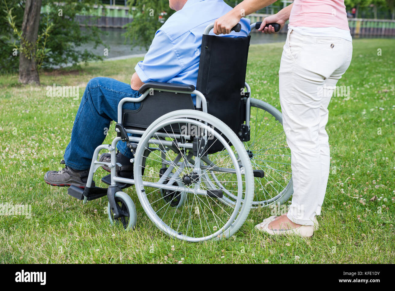 Close-up Of A Woman With Disabled Man On Wheelchair In Park Stock Photo ...