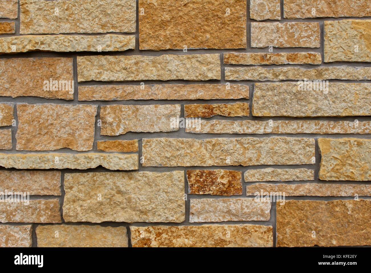 Modern Limestone (Kasota Stone) Brick Wall Background with Varying
