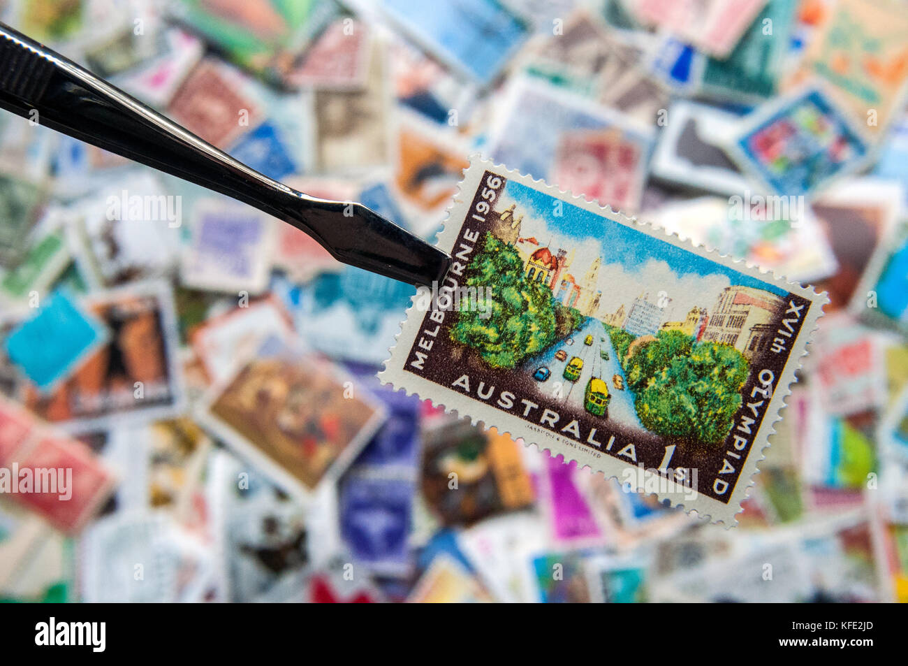 Australia 1956 Melbourne Olympic Games postage stamp over collection of other stamps Stock Photo