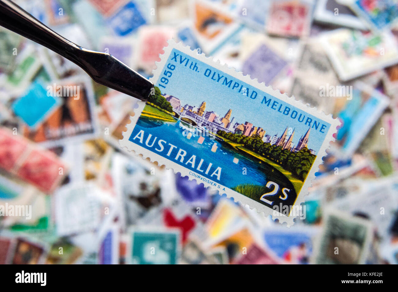 Australia 1956 Melbourne Olympic Games postage stamp over collection of other stamps Stock Photo
