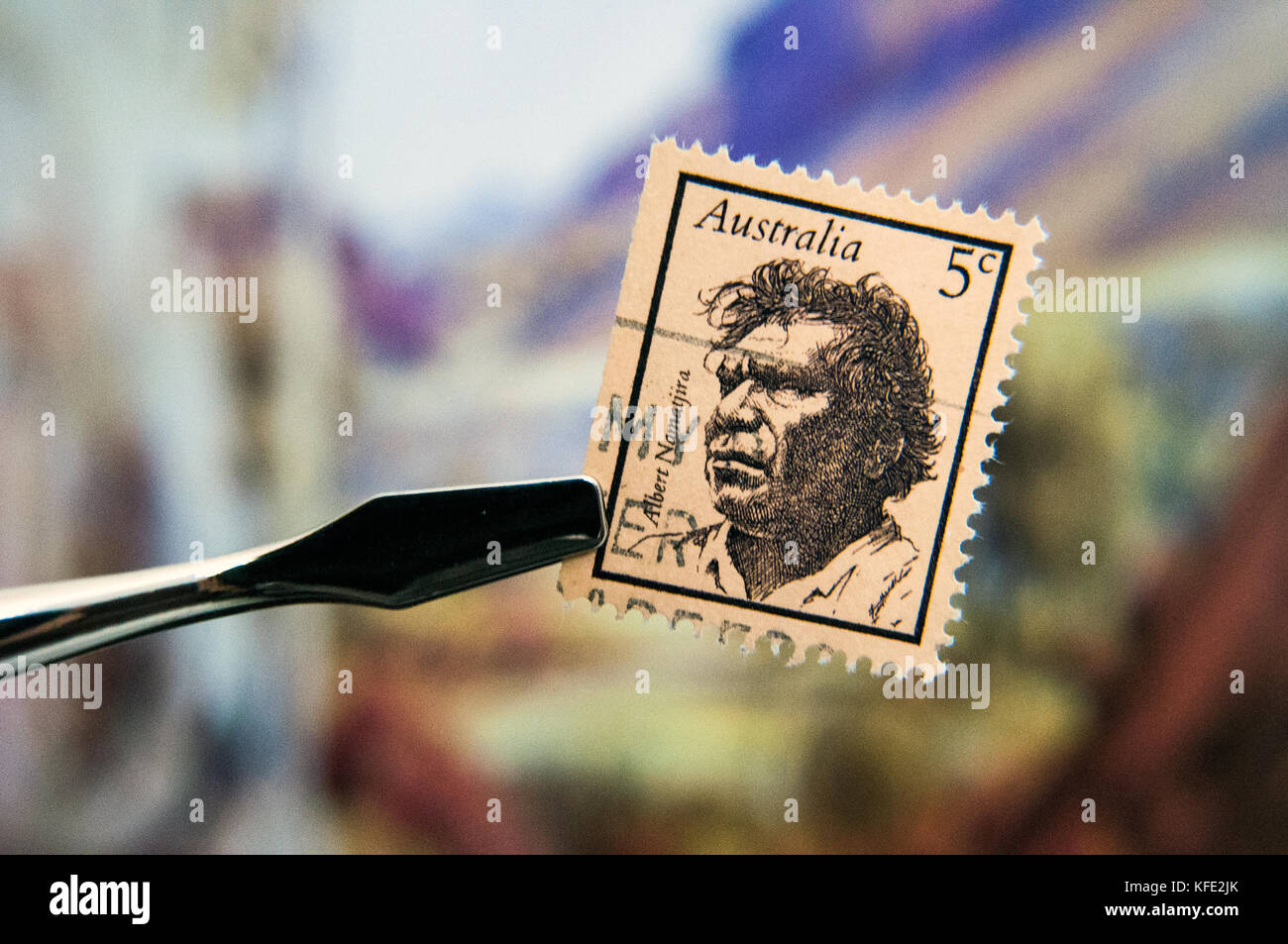 1968 Australia Albert Namatjira postage stamp in front of Namatjira art print Stock Photo