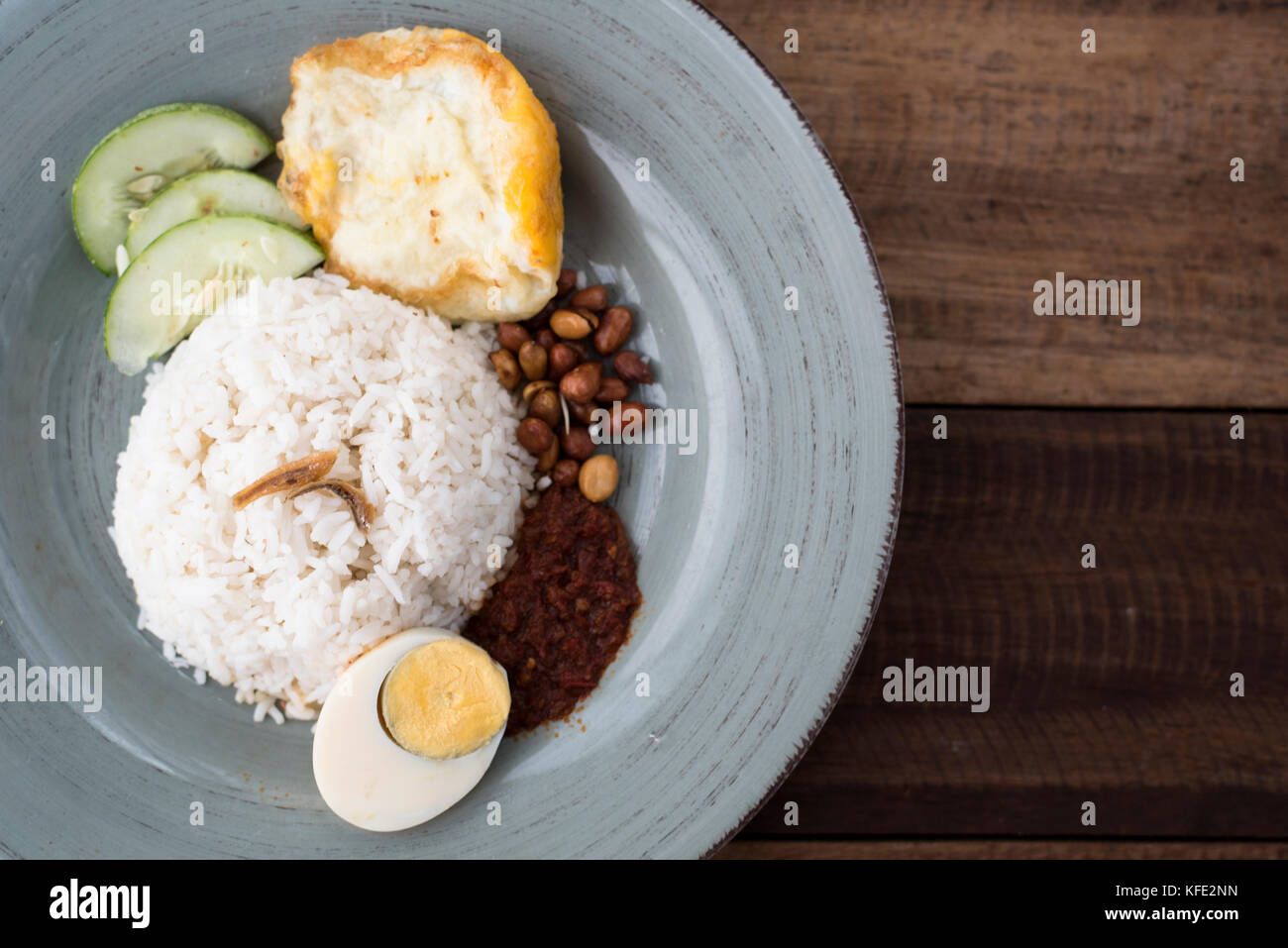 malaysian food/cuisine (nasi lemak) white rice with fried egg