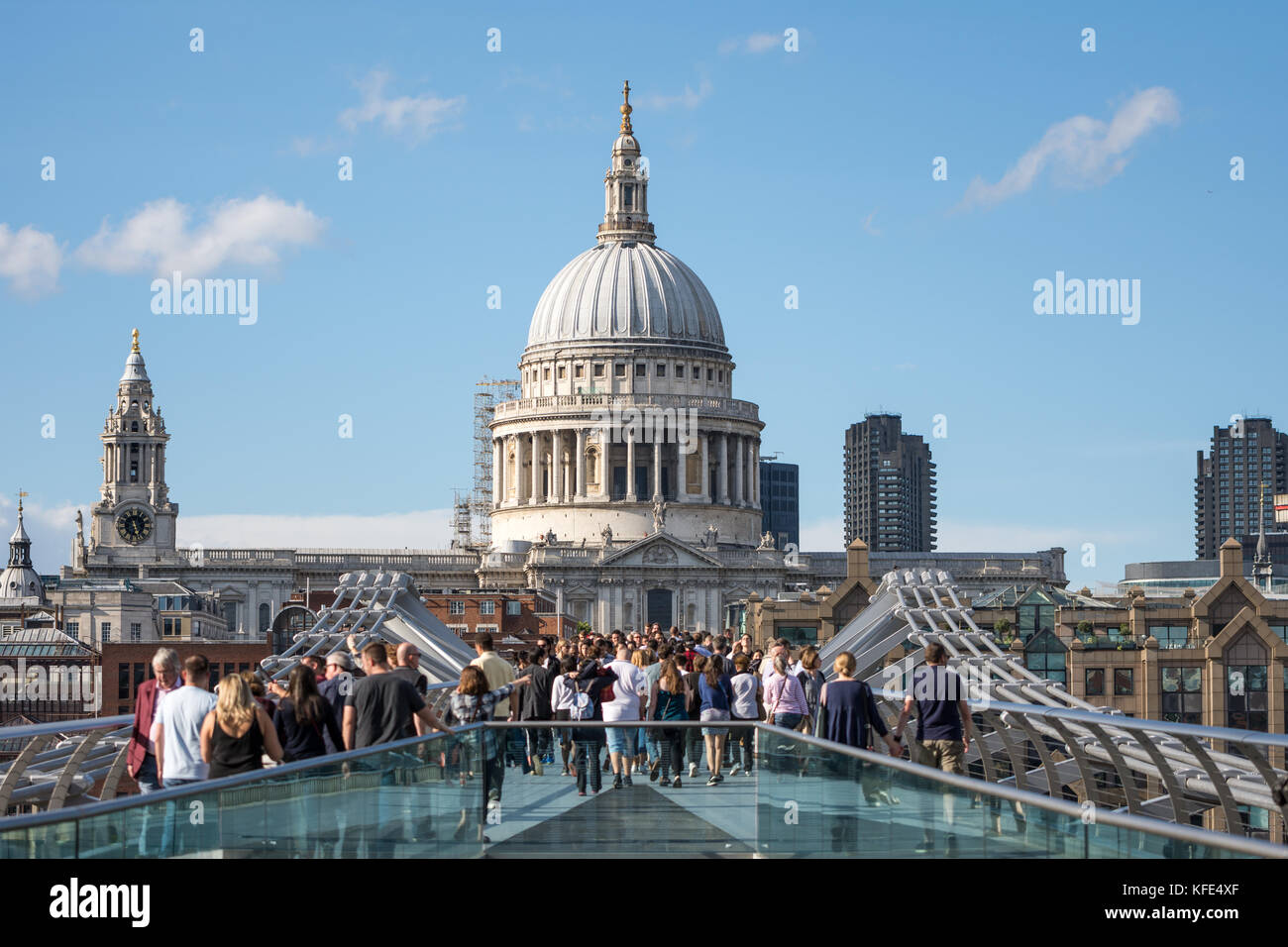 London, UK - August 05, 2017: St Paul's Cathedral with people walking on the Millenium bridge in the foreground Stock Photo