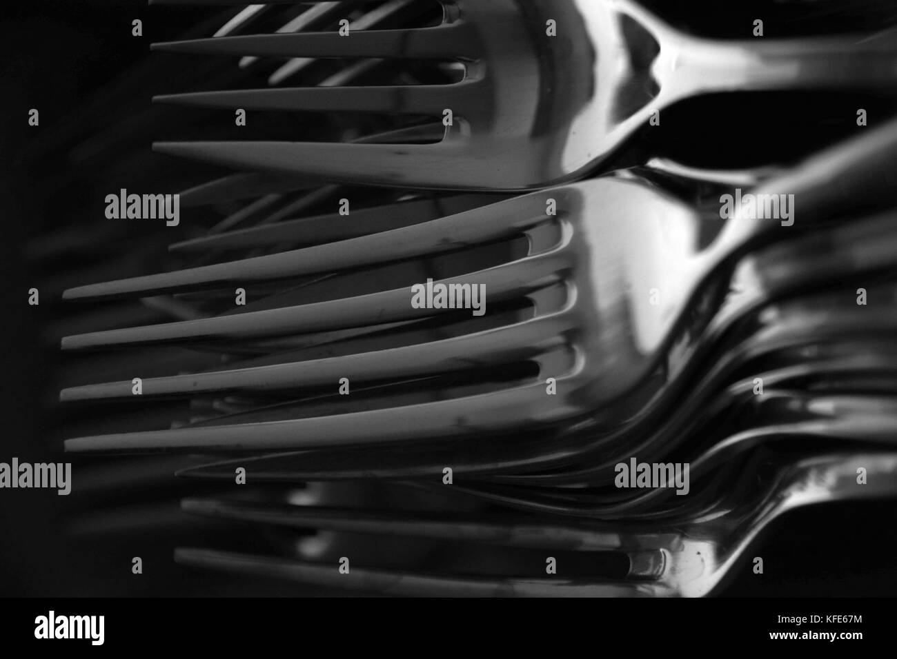 forks in black and white, abstract stacked forks in a cutlery rack