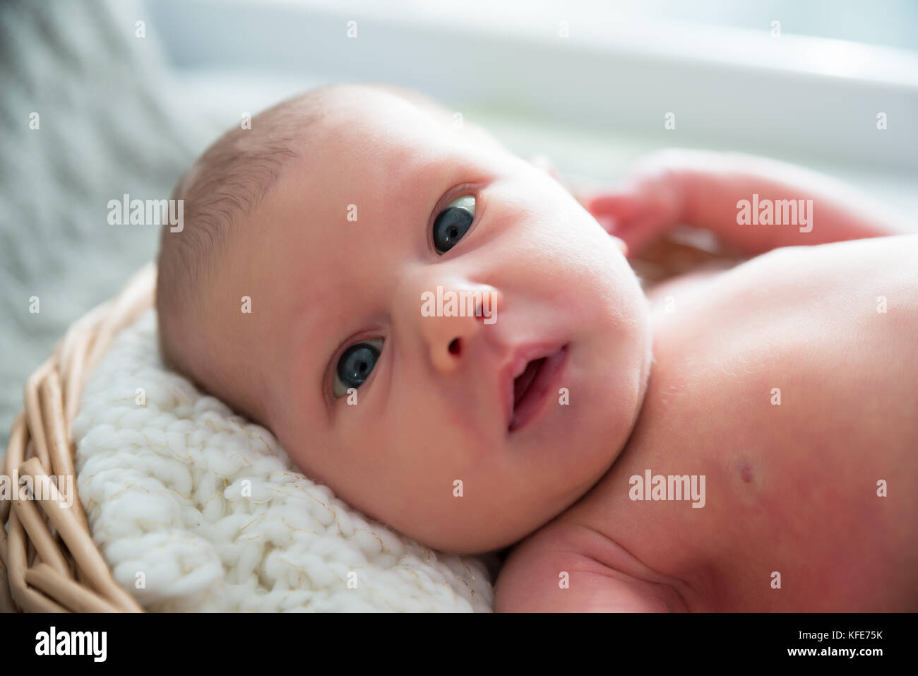 Close-up Of A Cute Little Baby Lying Stock Photo