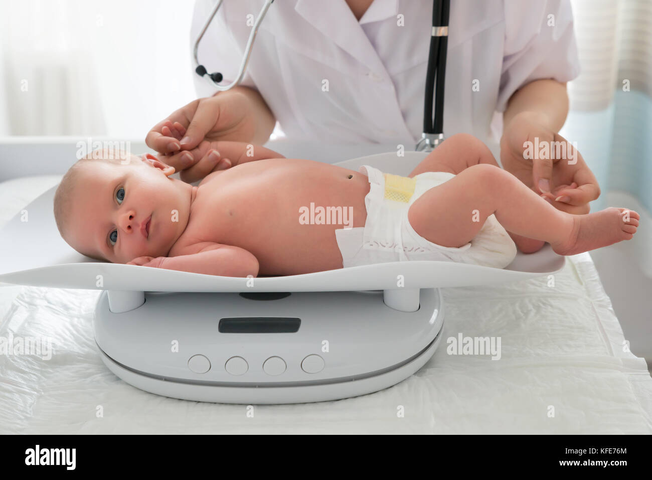 Newborn Baby On Scale. Physical Development Concept Photo Of Child Health  Care. Copy Space Stock Photo, Picture and Royalty Free Image. Image  45816478.