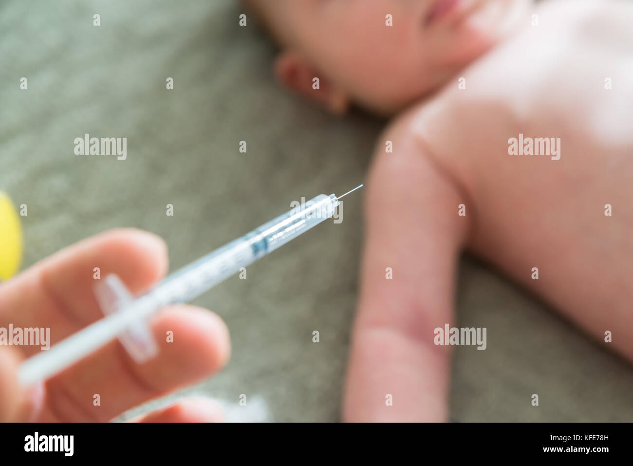 Close-up Of A Doctor Hand Vaccinating Baby Stock Photo