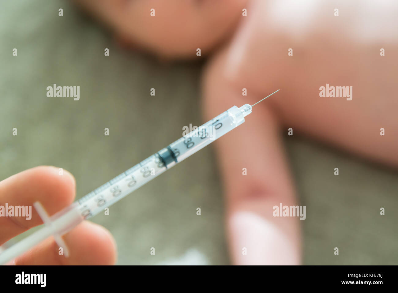 Close-up Of A Doctor Hand Vaccinating Baby Stock Photo