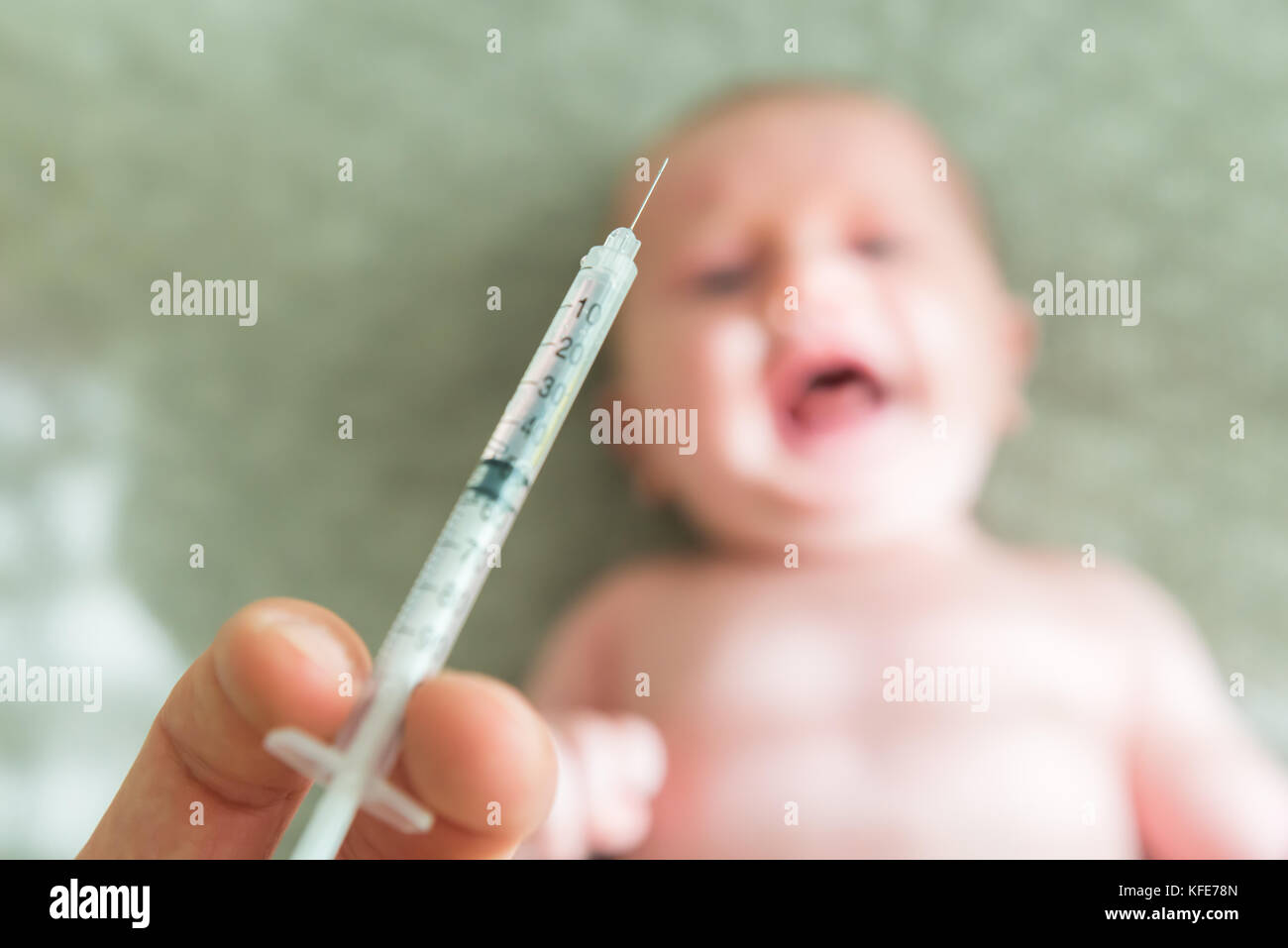Close-up Of A Baby Crying Over Vaccination Stock Photo