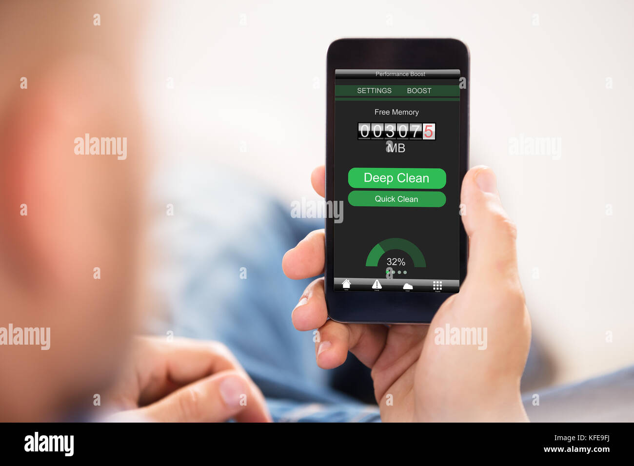Phone Memory Screen Man Optimizing Free Memory On Smart Phone Screen Stock Photo - Alamy
