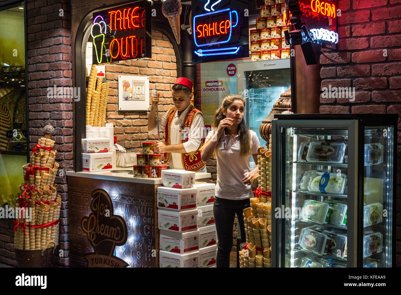 A young man and woman working in a traditional Turkish ice-cream shop. Istanbul, Turkey. Stock Photo